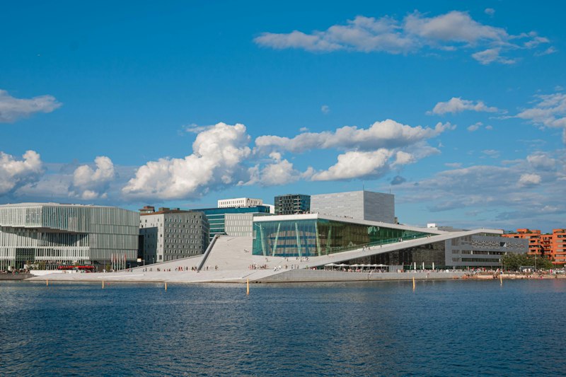 The Oslo Opera House beside the water on a sunny day