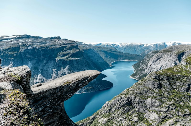 The Trolltunga rock ledge above the lake
