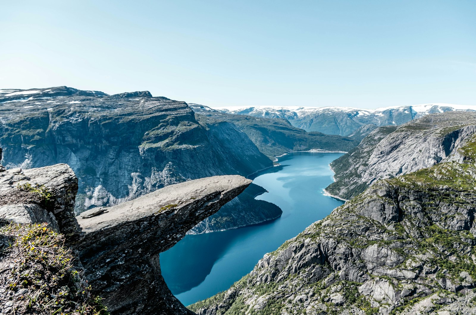 The Trolltunga rock ledge above the lake